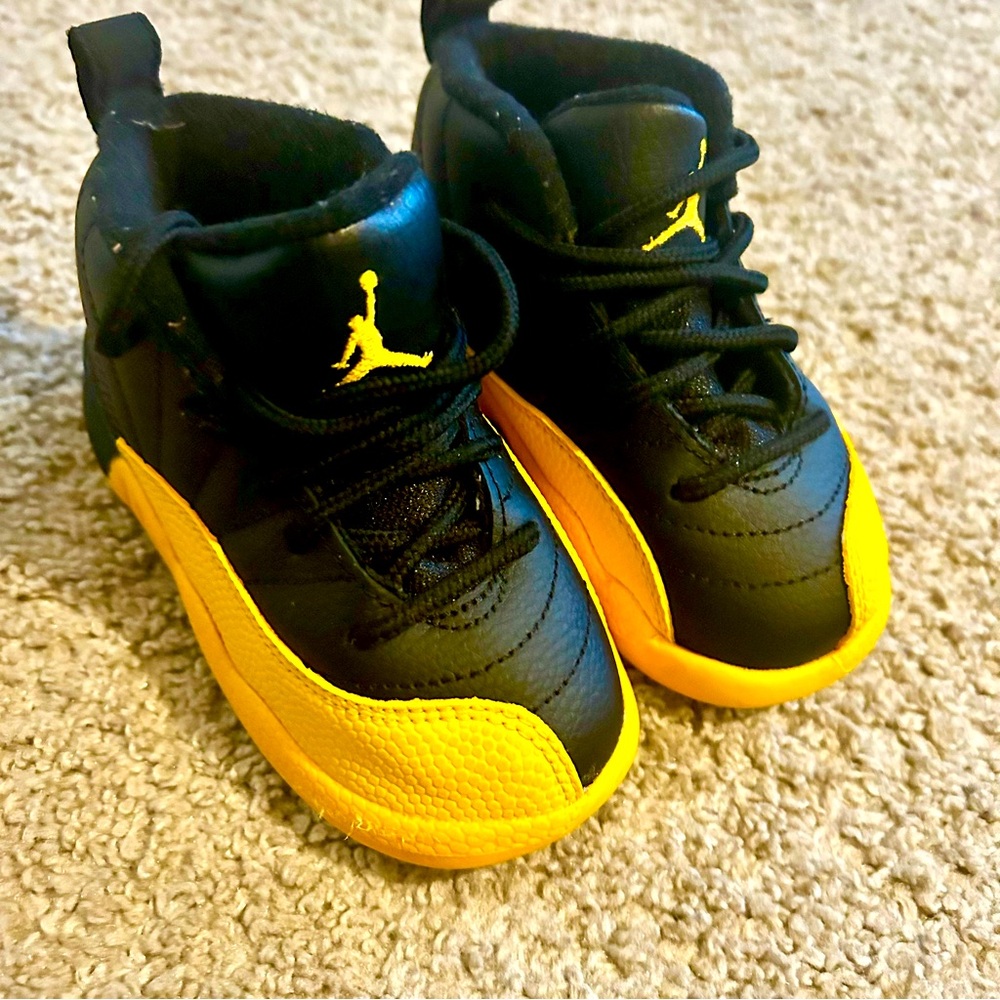 Toddler Jordan 12 Retro in ‘Black / University Gold’